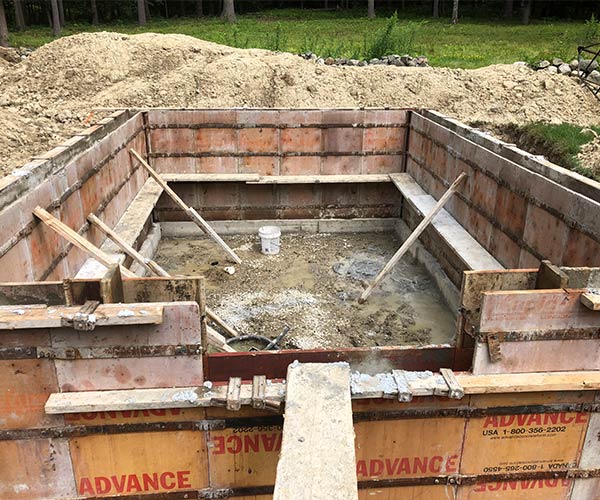 A look at foundation forms in place inside a recently excavated space in this residential backyard prior to the pouring of concrete